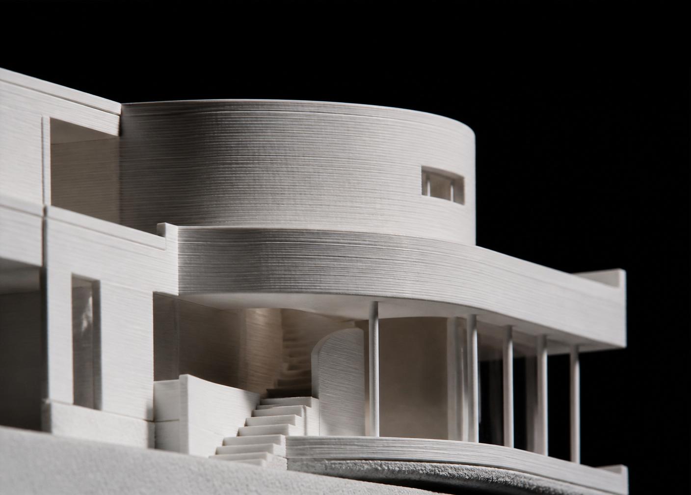 Fine 3D printed architectural detail photographed in a dark studio
